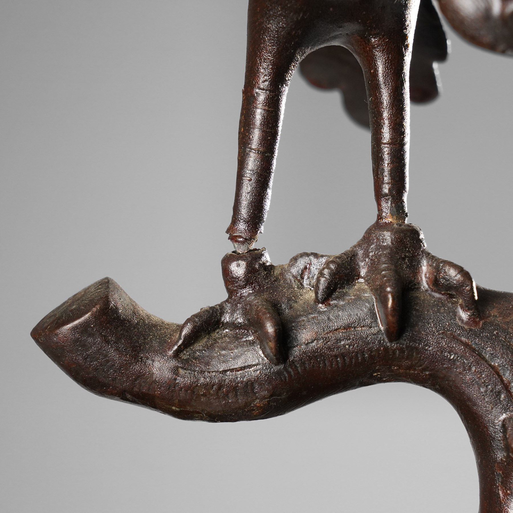 Japanese late Meiji period bronze koro and cover, surmounted by an eagle finial and with bird decoration in high relief to each side, twin elephant trunk handles, bearing indistinct character signature to one side, H82cm