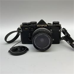 Olympus OM2 camera, 'no.264258', fitted with Olympus 'OM System G.Zuiko Auto-W 1:2.8 f35mm' lens and two other lenses, in a carry case