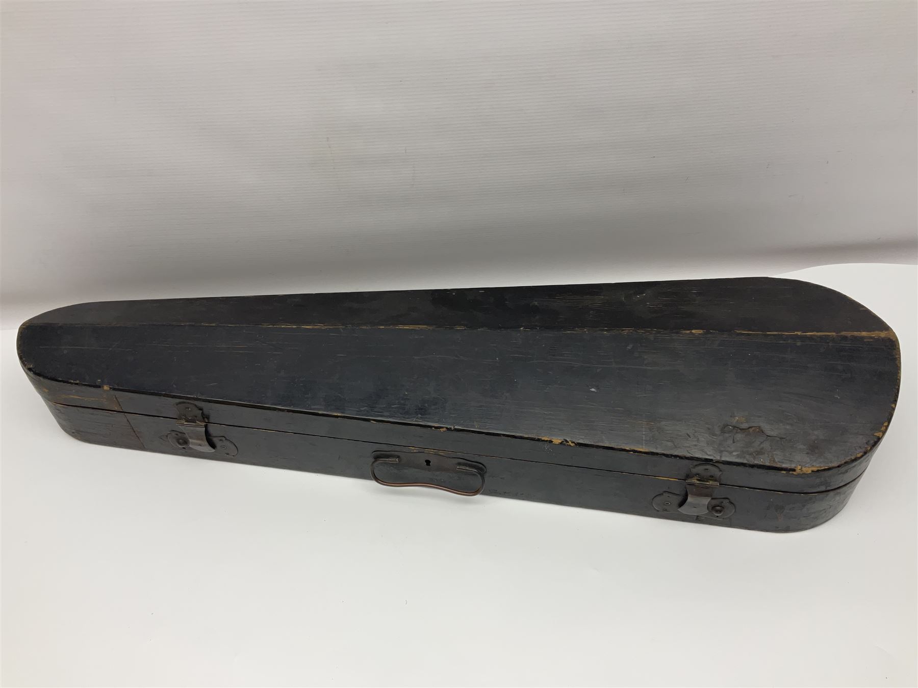 Late 19th century French three-quarter size 'Conservatory' violin with 34cm two-piece maple back and ribs and spruce top, the peg box inscribed 'Conservatory Violin Straduari', bears label 'Antonius Stradiuarius Cremonensis Faciebat Anno 1721' L55.5cm overall; in ebonised wooden 'coffin' case; and Saxony violin c1900 with 36cm two-piece maple back and ribs and spruce top; bears label 'Antonius Stradivarius Cremonensis Faciebat Anno 17**' L59cm overall; in carrying case (2)