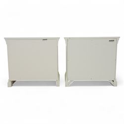 Coxwold Company - pair of white painted jumbo bedside cabinets, with two deep drawers and chrome knob handles,  shaped apron base