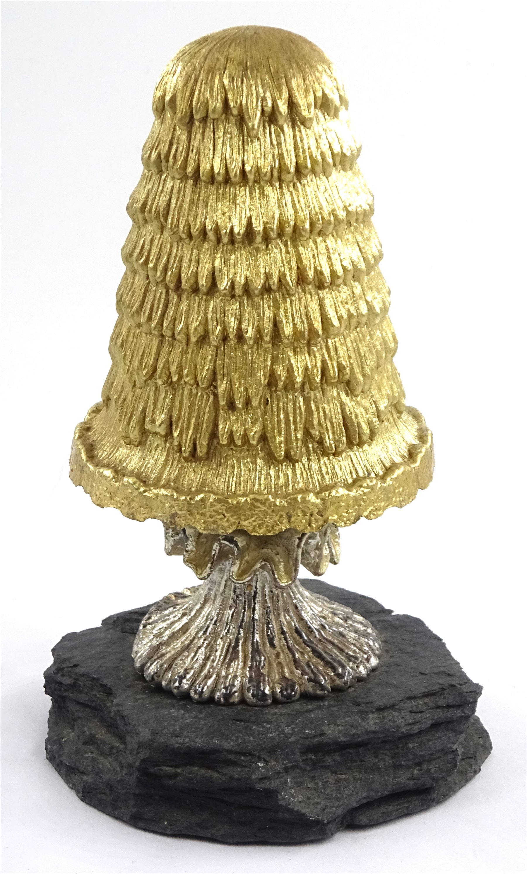 Christopher Nigel Lawrence limited edition silver and parcel gilt surprise mushroom, the textured domed cover opening to reveal two elves decorating a semi-precious gem set Christmas tree, upon a slate base, no 100/250, hallmarked Christopher Nigel Lawrence, London 1980, overall H9cm