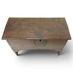 Small 17th century six plank oak coffer, figured top with iron pintle type hinges,  pegged boarded sides, large lock plate with rivets, plank ends continuing down as supports