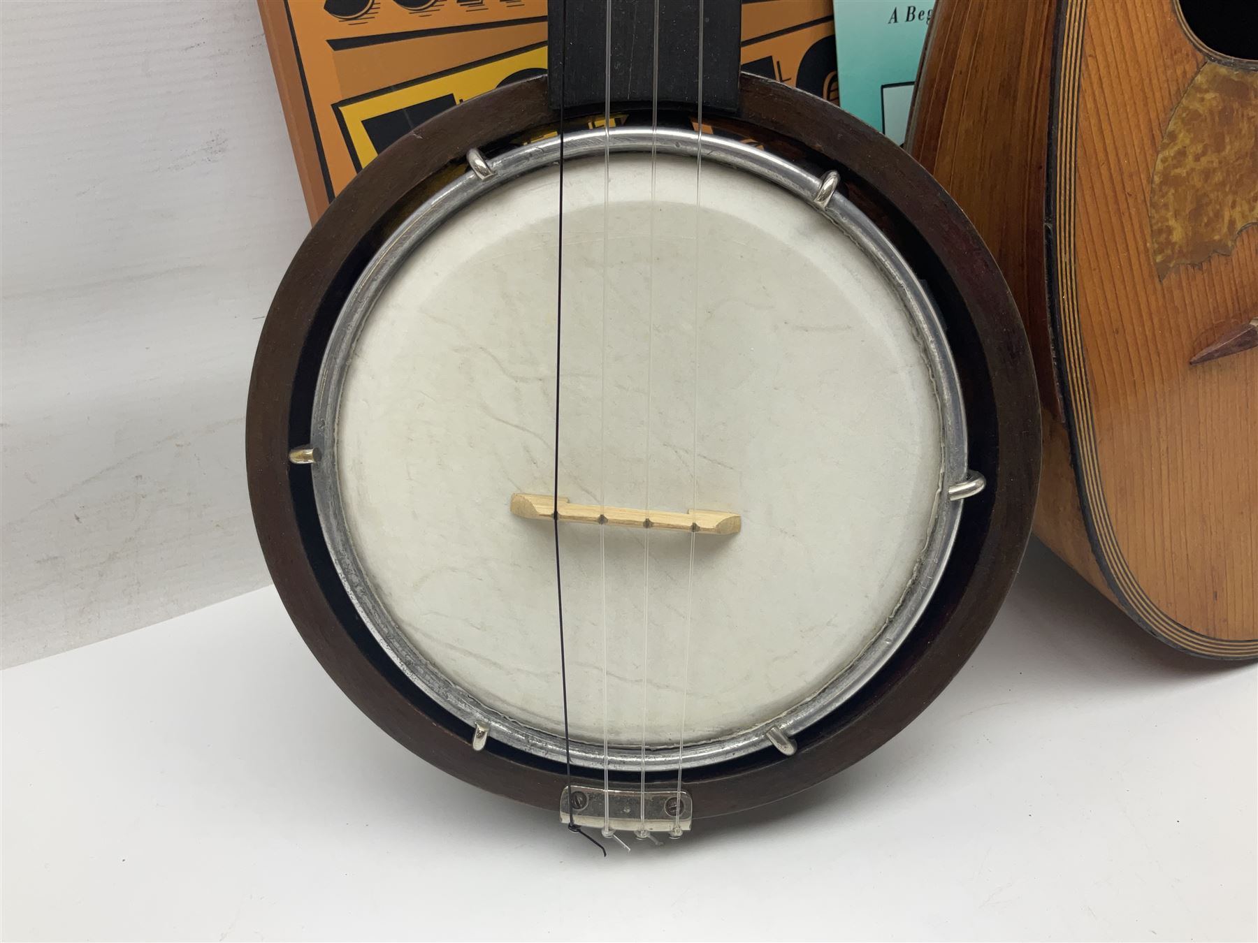W.D. Keech banjolele pat.219720/23 with etched signature to the back; serial no.A12082 L55cm; and a restored Italian mandolin with segmented lute back; together with three music books