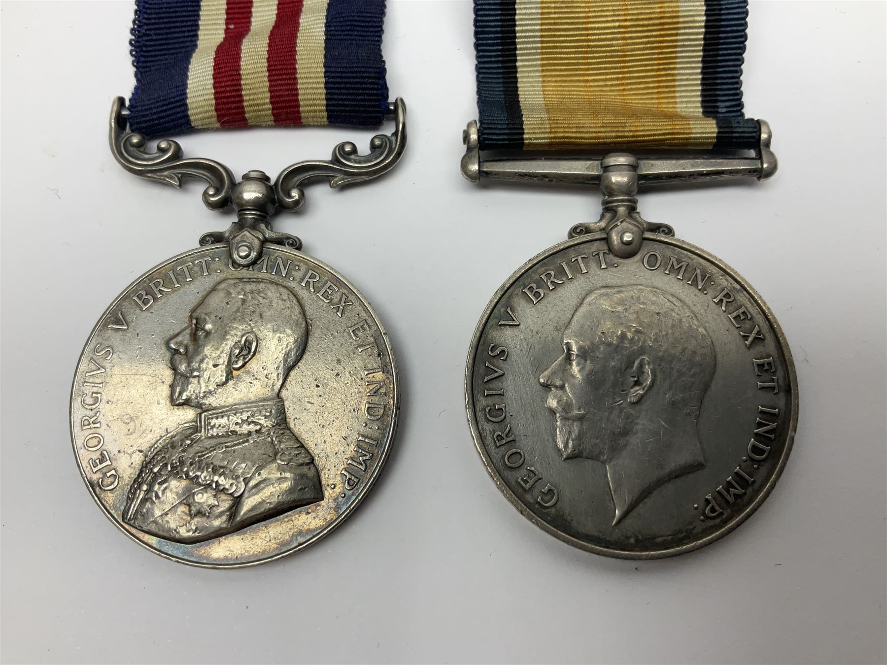 WWI RAMC Military Medal group of four comprising MM awarded to 439278 Pte. R.W. Sainsbury 1/3 S.M.F.A. R.A.M.C. T.F., British War Medal, Victory Medal and 1914-15 Star awarded to 2160 Pte. R.W. Sainsbury R.A.M.C.; all with ribbons; together with RAMC shoulder title
