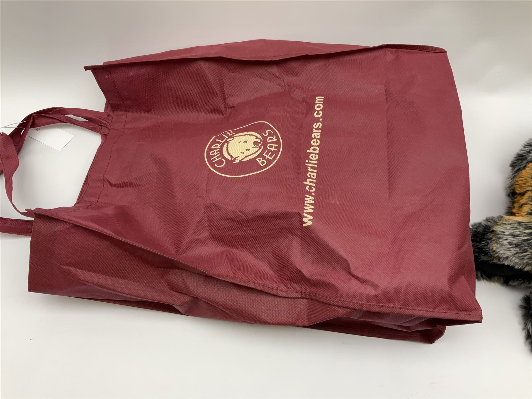 Charlie Bears teddy bear 'Manfred' designed by Isabelle Lee H53cm with bell pendant and tags in red carry bag