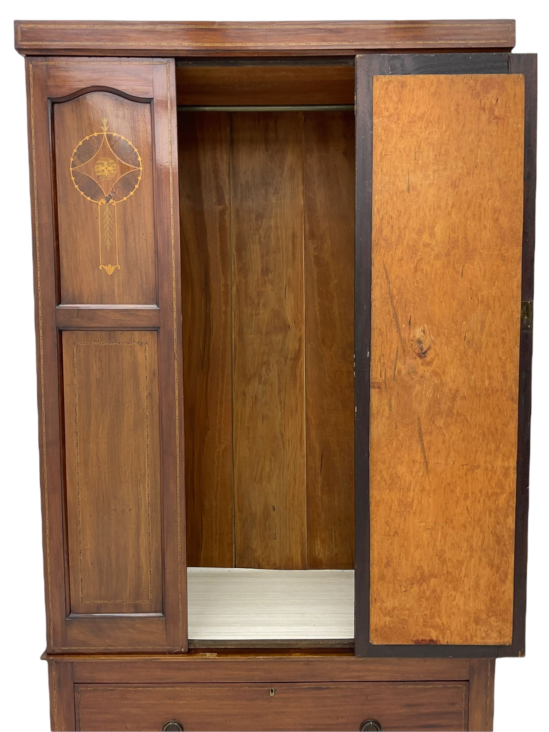 Edwardian inlaid mahogany wardrobe, oval mirror door, single drawer to base