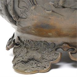 Japanese Meiji period bronze Koro, c.1870-1880, of squat baluster form, each foot with elaborate floral and mythical creature decoration, the body depicting two lions in chase, the rim with Greek key border, the pierced cover with eagle finial, Yoshida foundry mark to base, H50cm
