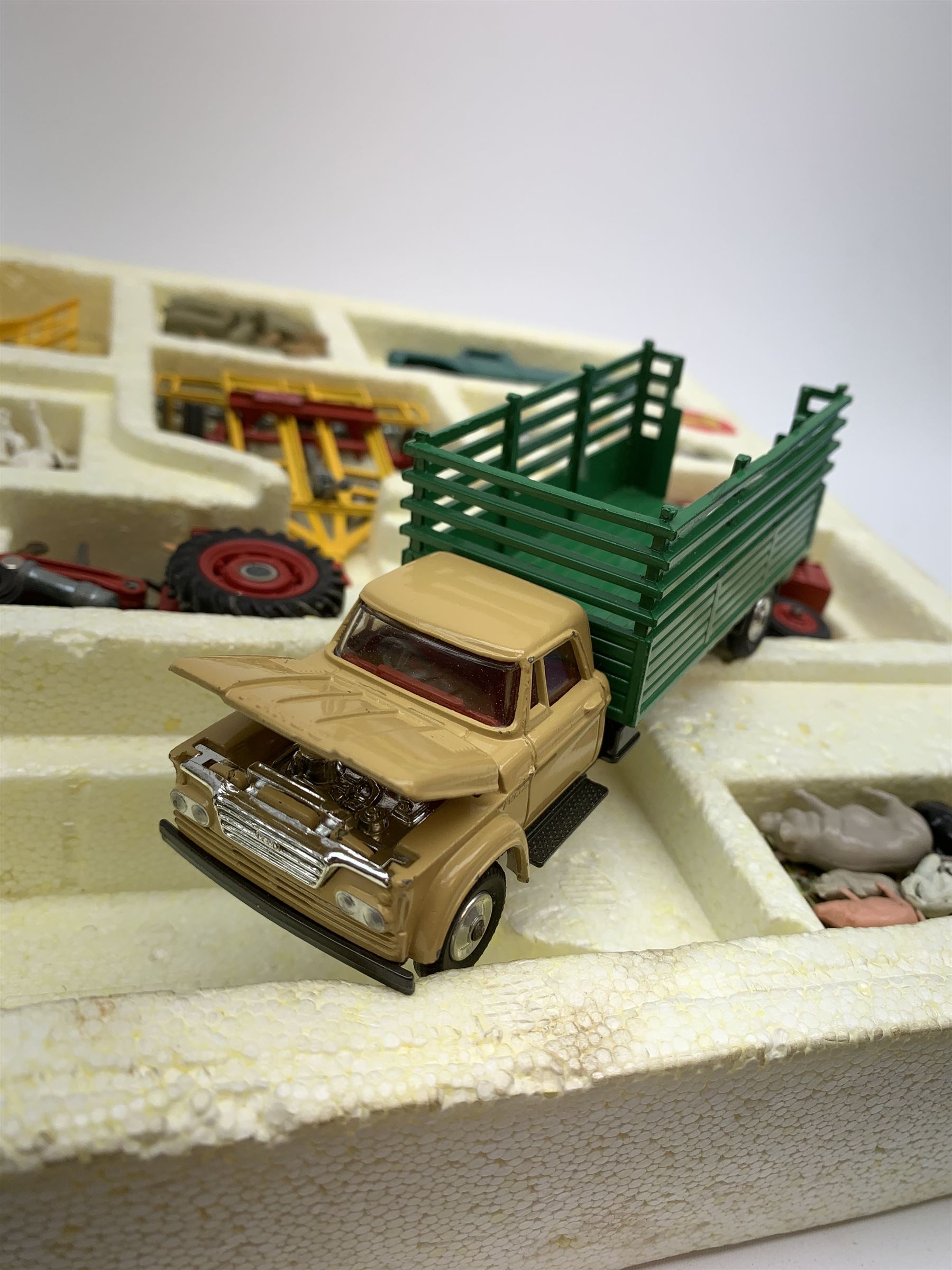 Corgi Toys Agricultural Gift Set No.5 containing Massey-Ferguson 165 Tractor with shovel and skip and churns attachment with two churns, Tandem disc harrow, farm tipper trailer with raves, Land Rover, Dodge Kew Fargo truck with four cattle and four pigs, farm worker and dog,  eleven large sacks and five small sacks, boxed