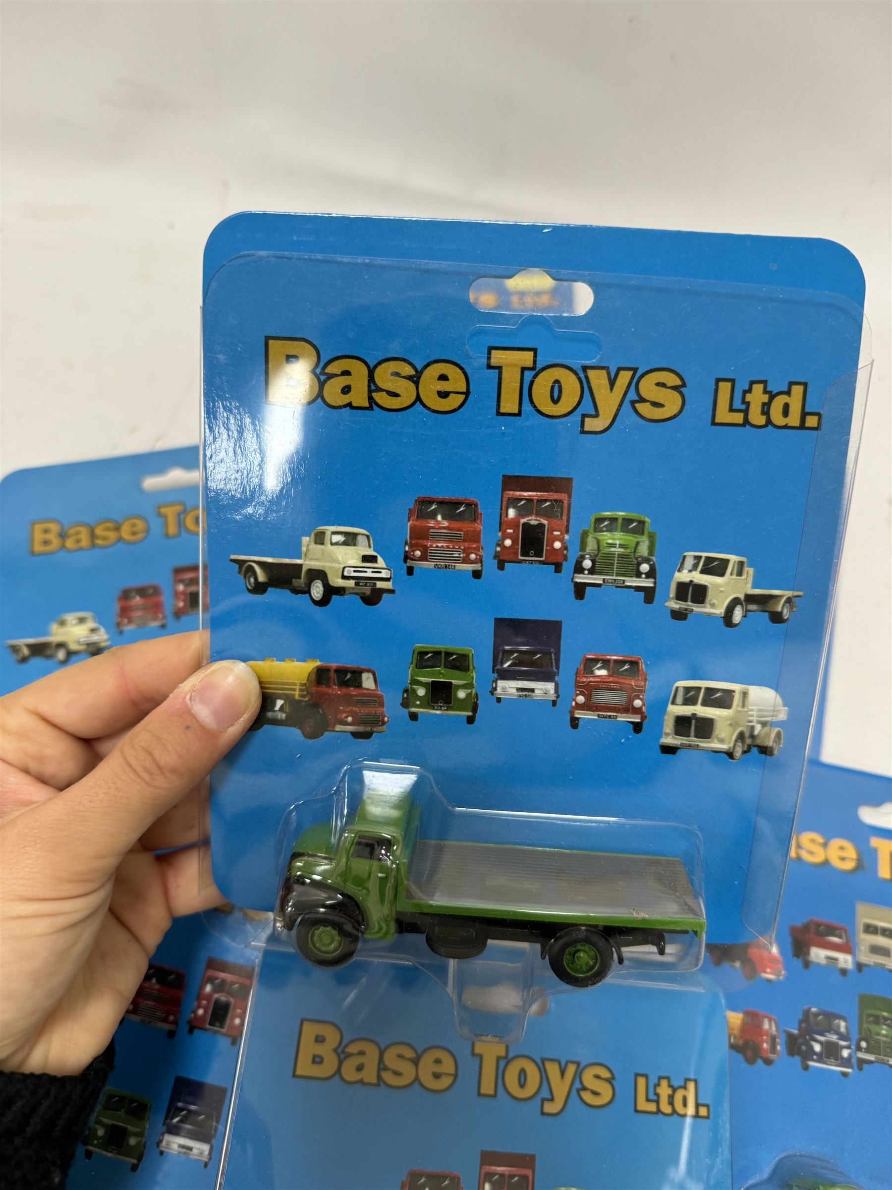 Twenty one Base Toys 1:76 scale diecast vehicles, all in original blister packs
