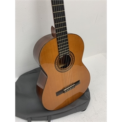 Admira Spain Virtuoso acoustic guitar , bears label, 101cm overall, in soft carrying case; together with a Seiko quartz guitar tuner (2)