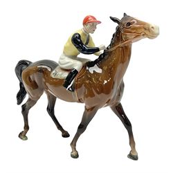 Beswick jockey on walking horse no 1037, in black white and yellow jockey colours, with printed mark beneath, H22cm
