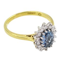 18ct gold aquamarine and round brilliant cut diamond cluster ring, London 2000, aquamarine approx 0.60 carat