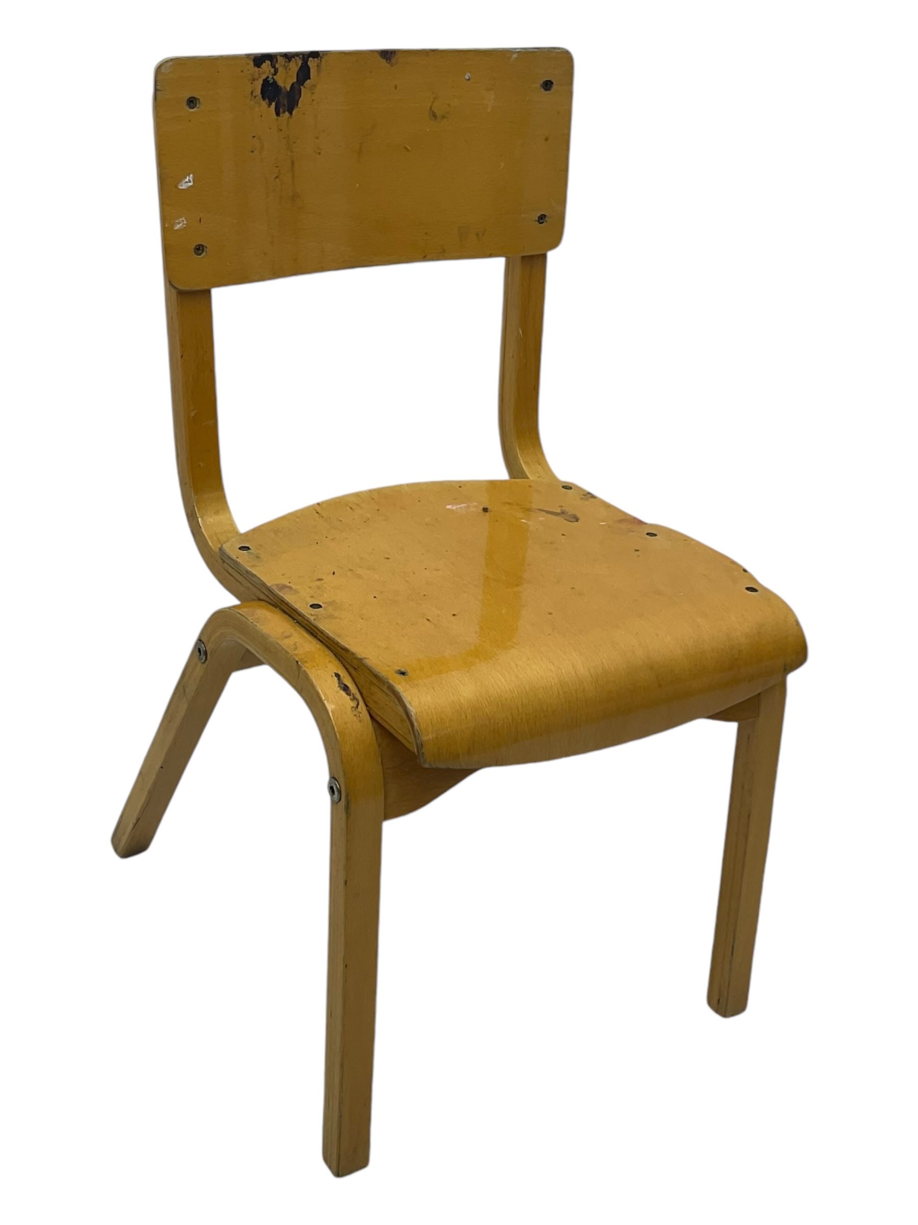 Mid-20th century beechwood school desk, rectangular lift-top desk with storage compartment, supported by square legs with cross stretchers; two matching beech chairs (3)