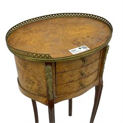 French design figured walnut bedside stand, oval form and fitted with three drawers, on cabriole supports