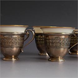 Set of six Lenox porcelain coffee cups, with gilt rims, each with American silver openwork cup holders, stamped sterling