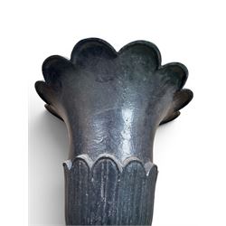 Pair of Victorian large scale cast iron garden urns, flared petal shaped rim with tapering waist, gadrooned base on square plinth, finished in black paint