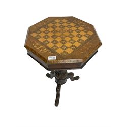 Late 19th century inlaid walnut sewing or work table, octagonal hinged top with satinwood and ebony chessboard inlay, surrounded by foliate decoration, the edges inlaid with crossbanding and stringing, fitted interior with chess pieces, raised on baluster pedestal carved with acanthus leaves on a tripod base 