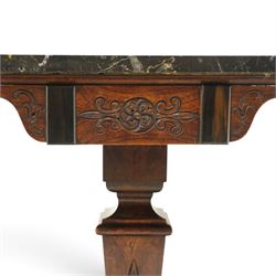 Early 19th century Anglo-Indian rosewood and specimen marble chess table, the octagonal top inset with a chequerboard of various coloured marbles within a broad fossil marble border and black marble edge, over a foliate and rosette carved frieze and turned-and-tapering pedestal with lotus-carved decoration, on a concave-sided quadripartite platform base with anthemion carved scroll terminals, inset ivory roundels and brass bun feet
