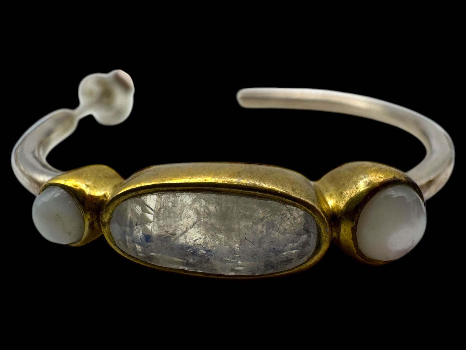 Six pairs of silver earrings, including opal pendant earrings and a pair of moonstone hoop earrings