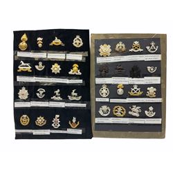 Collection of thirty-two reproduction military badges, including Royal Scots Fusiliers, Royal Lincolnshire Regiment, The Boarders Regiment etc. 
