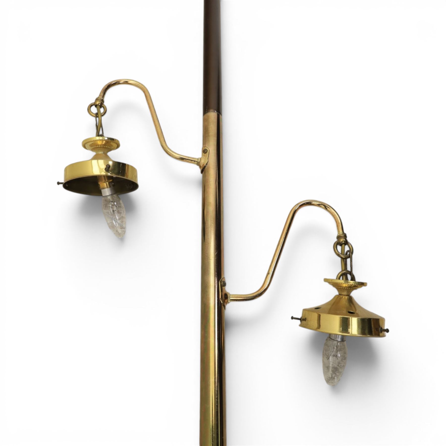 20th century floor to ceiling two branch standard lamp, with spring loaded ceiling mount, brass column, with octagonal moulded rim, green leather inset tooled 