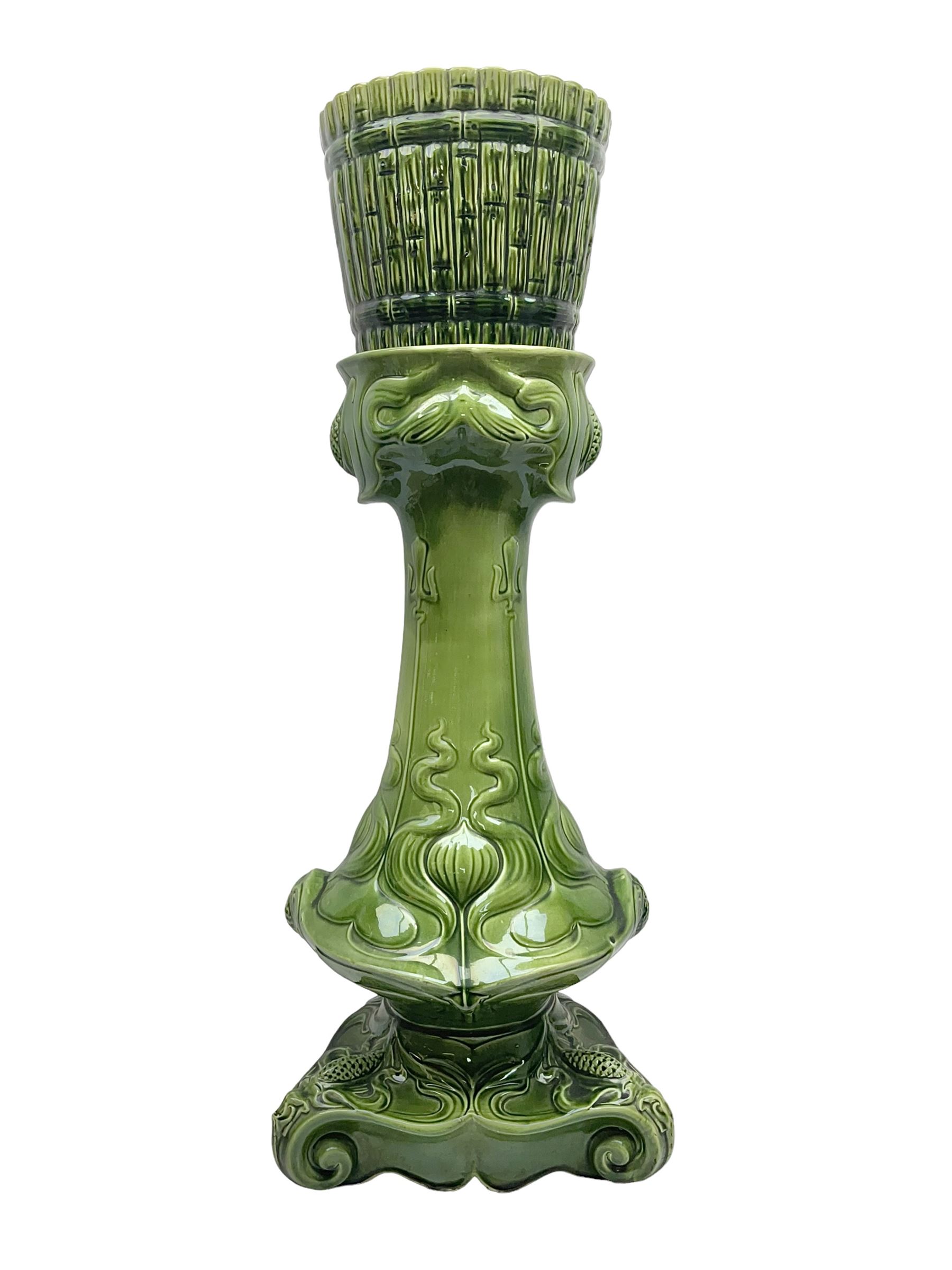 Jardiniere and stand, the jardiniere modelled as a pale, the stand with foliate and foliage decoration on a green ground, stand H73cm 