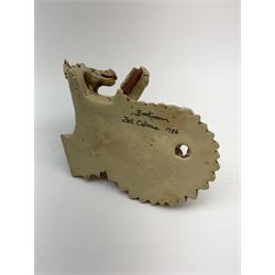 Zell Osbourne (British, Contemporary), Bookworm, a Studio Pottery figure modelled as a recumbent dragon with book, L21cm. 