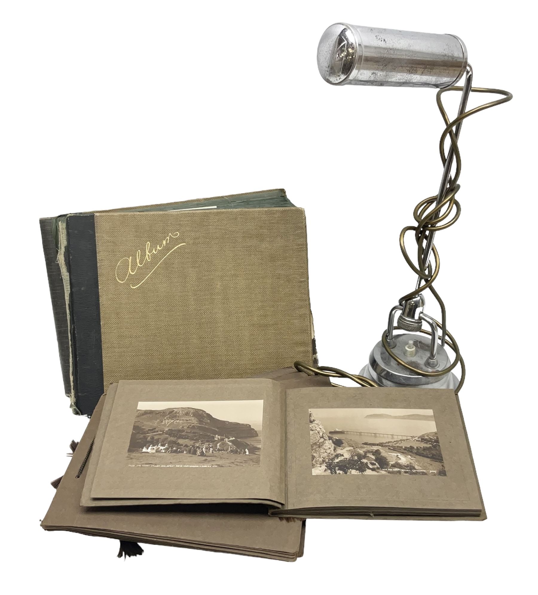 Quantity of post cards in six albums, local interest and photographic postcards, together with an art deco style table lamp
