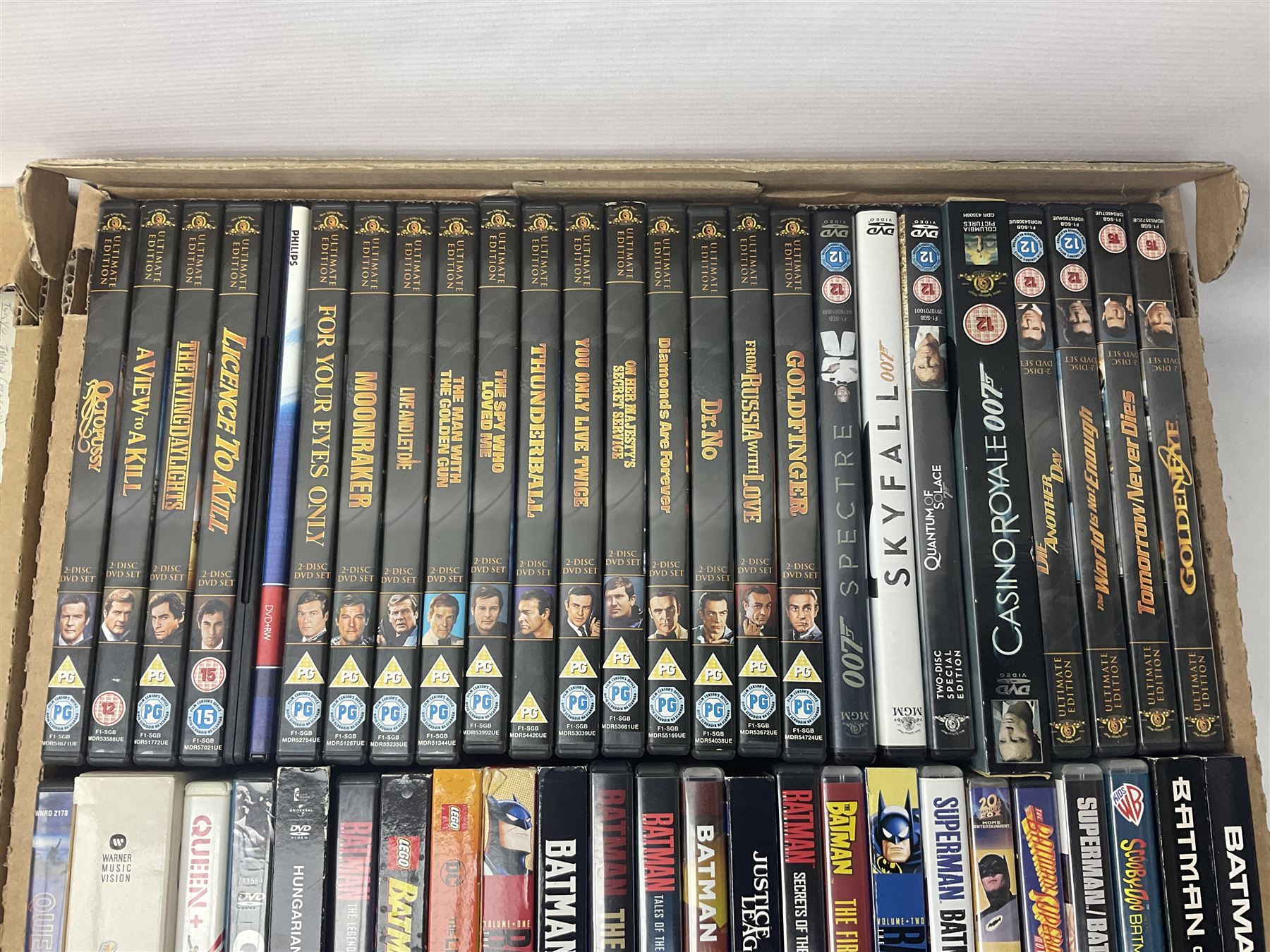 Large collection of VHS tapes, DVDS, CDs to include Queen, James Bond 007, Batman etc, in three boxes
