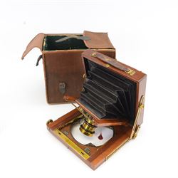 UNABLE TO SELL Two mahogany and brass half plate cameras, comprising E & T Underwood camera and a Taylor's Drug Co. Ltd 'The Albion' camera, each with Thornton Pickard 'Snap Shot' lenses, all with ivory maker's plaques, with a glass plate and a canvas carry case