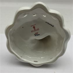 Royal Crown Derby figurine, Winter, modelled as a man with crossed arms on ice skates, by M. Townsend, with printed marks beneath, H24cm