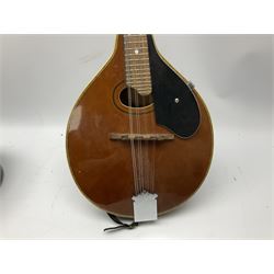 Palmer eight-string mandolin with mahogany back, simulated ivory and mother-of-pearl mounts L67cm; and Mahalo mahogany cased baritone scale ukulele, model no.U320B, L76cm; in hard carrying case (2)