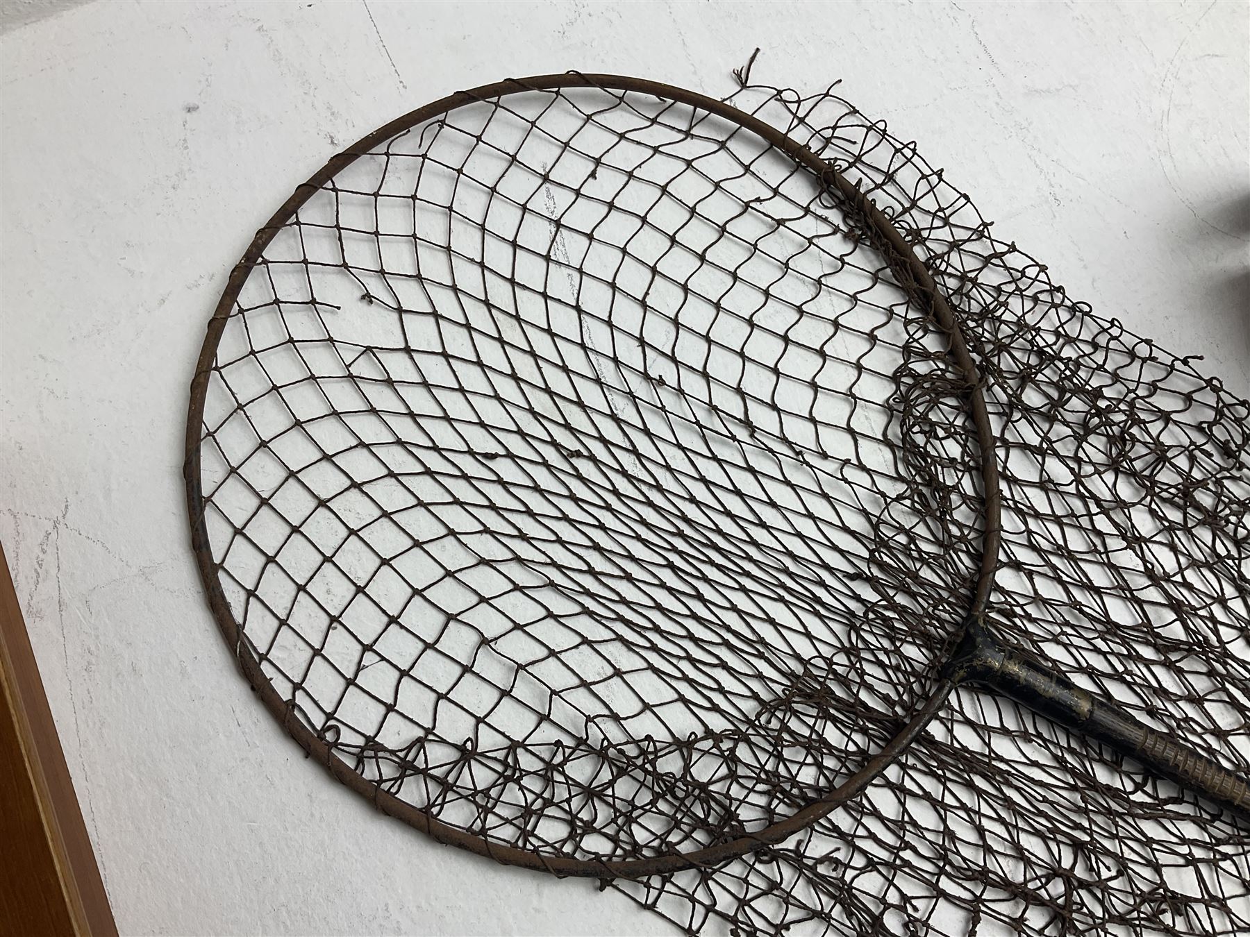 Fishing tackle and accessories housed in two wicker creels, including a landing net, fly tin, small brass reel, other reels to include two Intrepid Boy'o examples, crab lines etc 