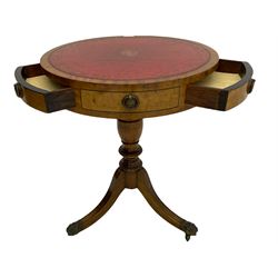 Georgian style mahogany drum table, circular leather inset top on turned column with three splayed supports, hair paw castors
