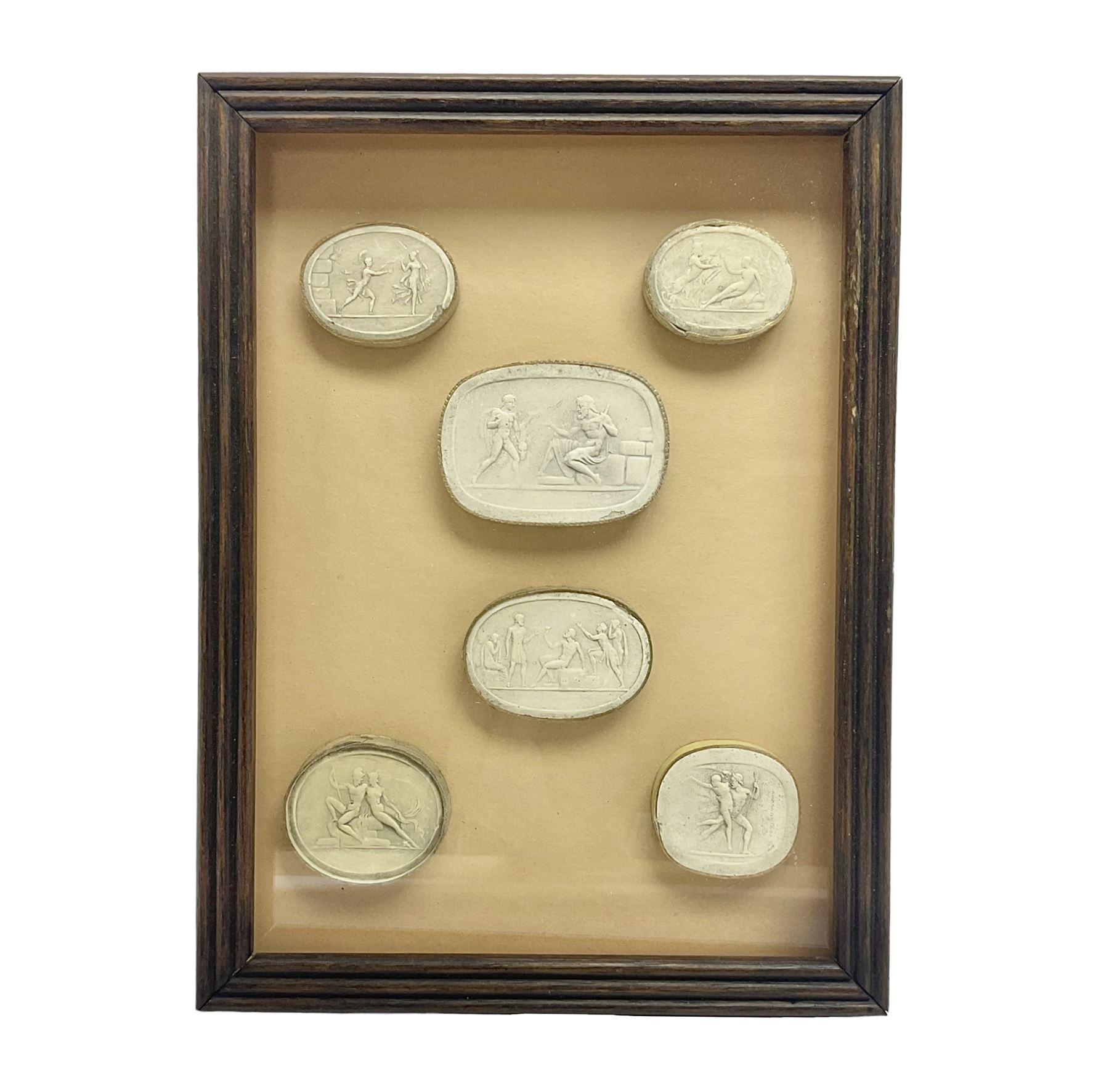 Set of six 19th century Grand Tour plaster intaglios, each depicting classical figures, frame H25cm, W19cm