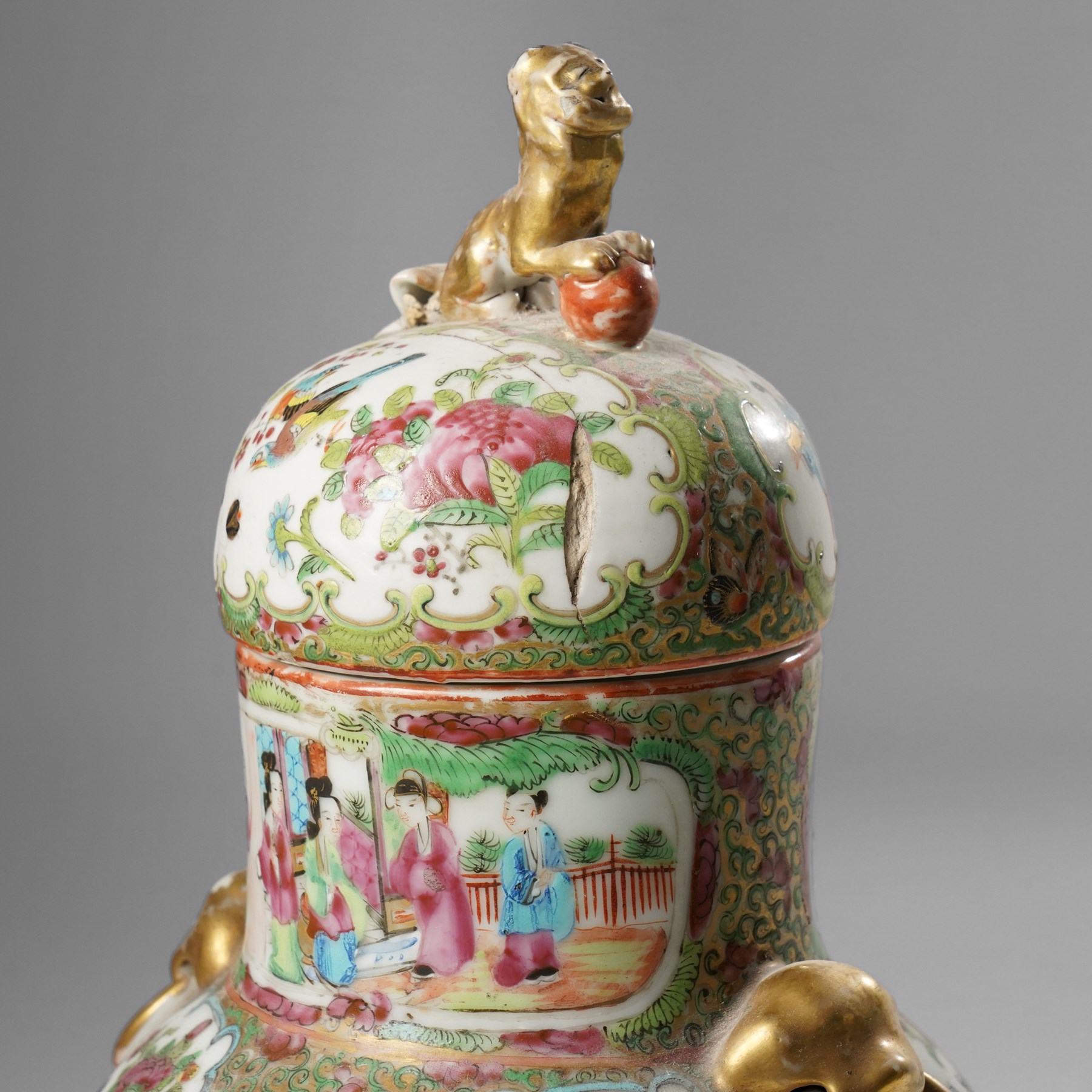 Cantonese famille rose vases, of inverted baluster form, the domed cover with gilt dog of Fu finial, H38cm; together with a further pair of Cantonese vases, each with double Buddhist lion handles and applied at the shoulders with chilong, H45cm (3)