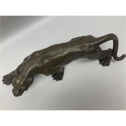 Bronze figure, modelled as a cougar in crouching pose, after Milo and with foundry mark, L40cm. 