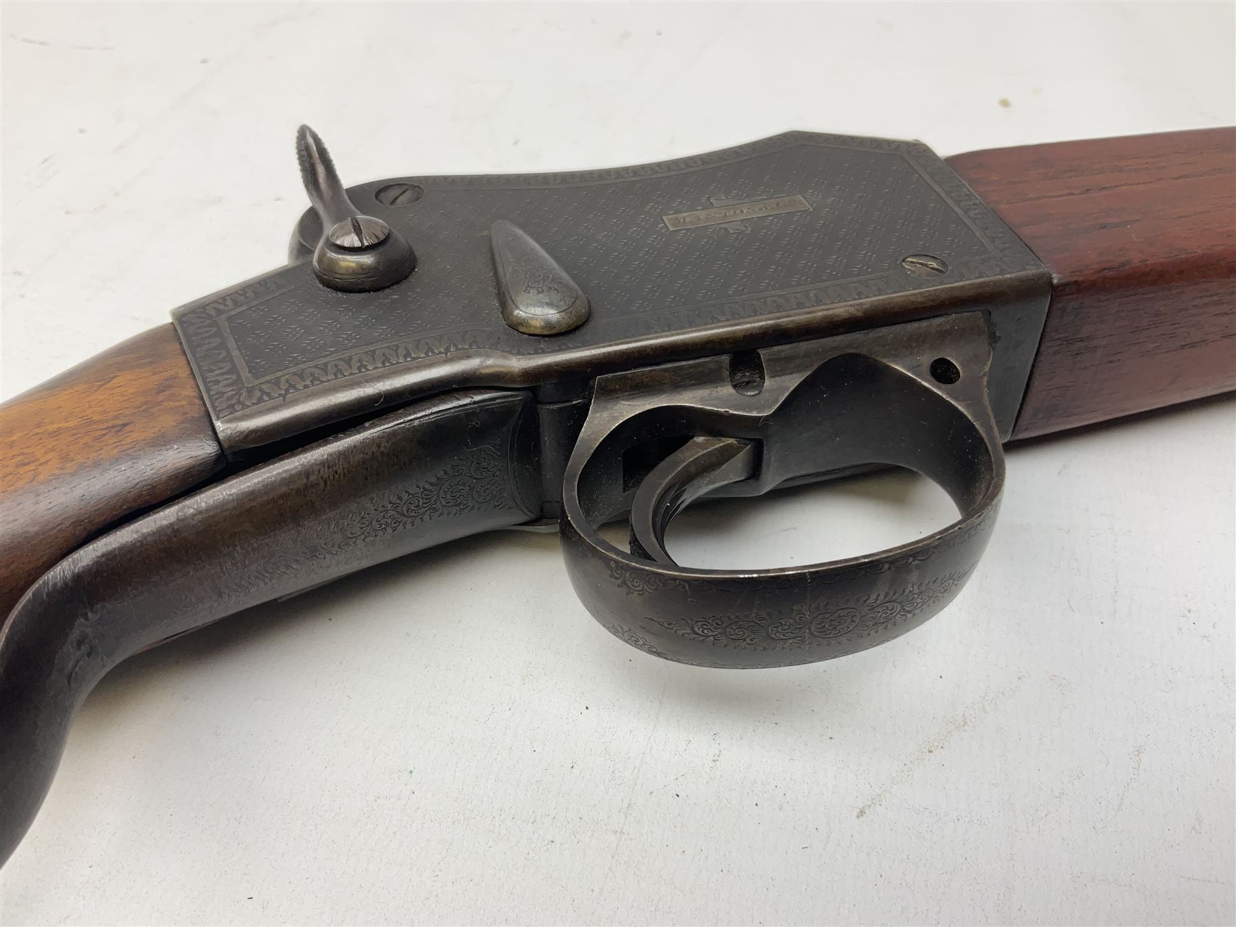 Manton .577/450 Martini Henry rifle, the 82.5cm smooth bored barrel proofed for shot, two barrel bands and bayonet fitting, engraved action with side safety, figured walnut stock with chequered steel butt plate, complete with ramrod, NVN other than 5346 on barrel, L125cm
