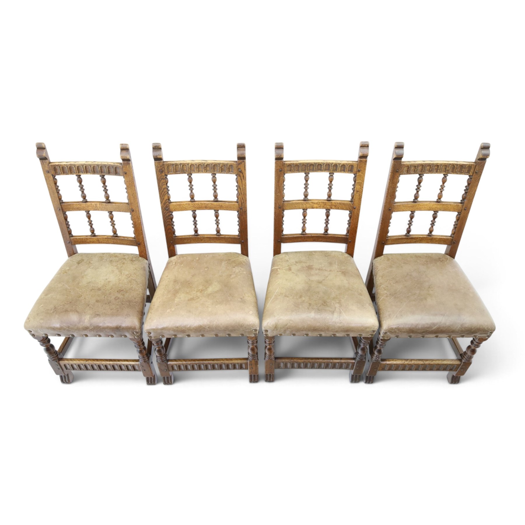 Rupert Griffiths for Monastic Woodcraft - oak 6ft refectory dining table with set six (4+2) matching chairs, rectangular top with arcaded frieze, with trestle base with further arcaded carved stretchers, chairs with carved rails and finials, leather wrapped seats with stud detail, turned supports united by carved stretcher