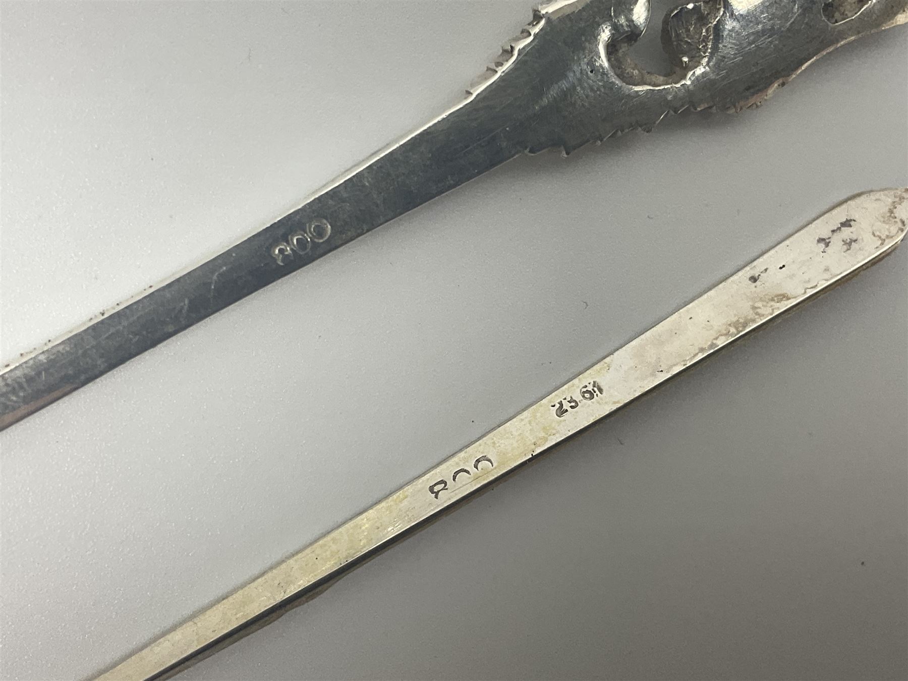 Early 20th century cut glass silver sugar caster, hallmarked C B Thomas & Co, Birmingham 1910, together with silver pepper, hallmarked, a continental silver pickle fork, stamped 800 and a plated cake fork