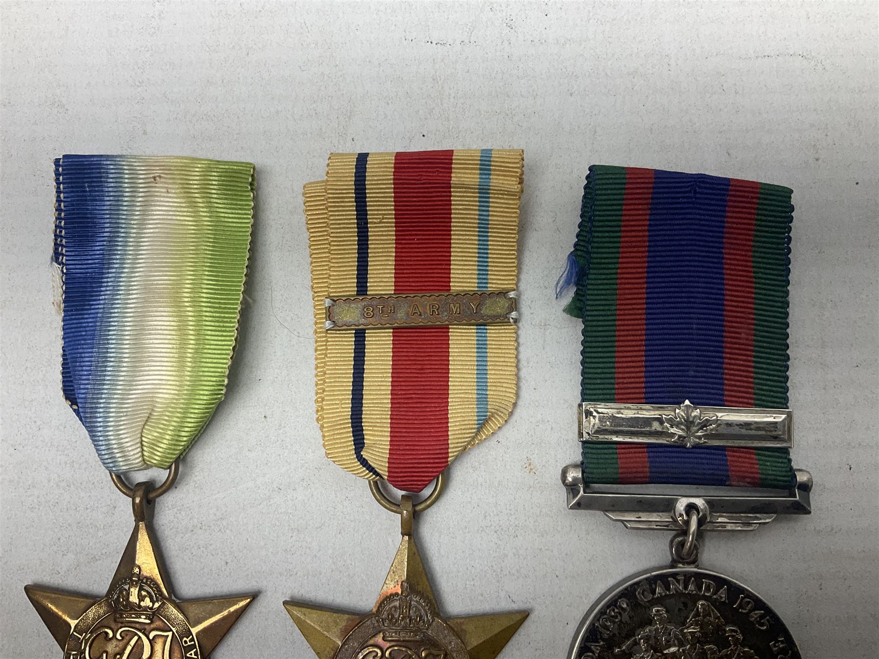 WW2 Canada Volunteer Service Medal 1939-45 with maple leaf clasp; and five WW2 Stars - Burma Star, Atlantic Star, Africa Star with 8th Army clasp, France and Germany Star and Pacific Star with Burma clasp; all with ribbons (6)