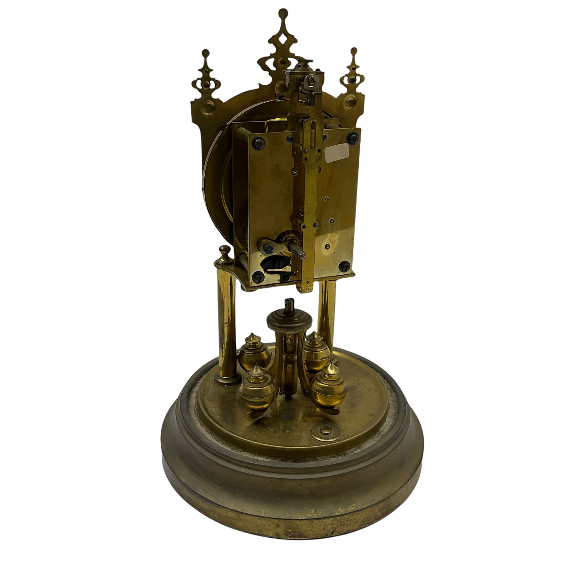 A 20th century rotary pendulum torsion clock under a glass dome with a