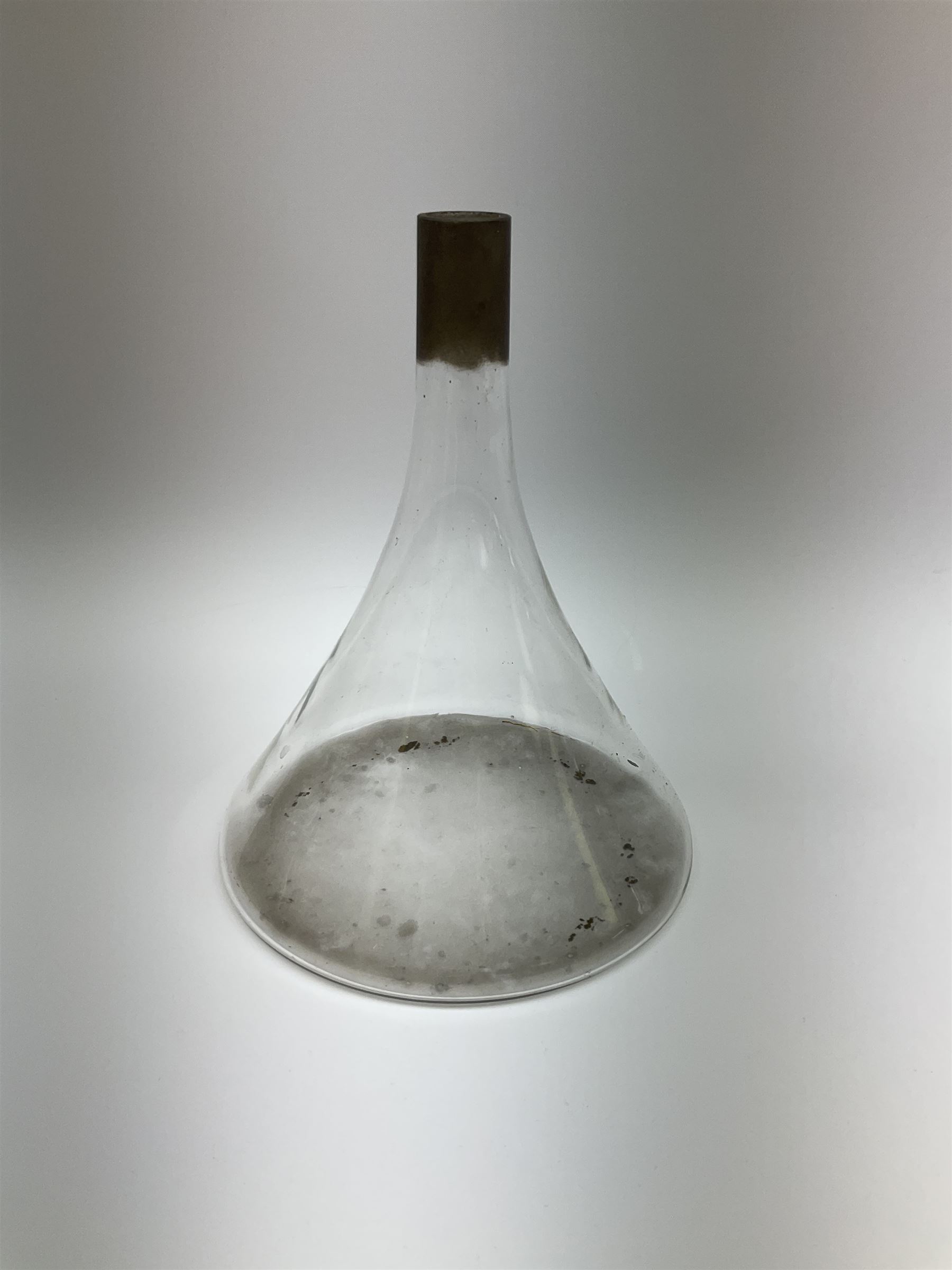Collection of 19th century and later pharmaceutical laboratory glass, to include, large filter funnel, graham condenser, conical flask, bell jar and another with graduated tube, Provenance: discovered in the storeroom of a long established Hull pharmacist and opticians