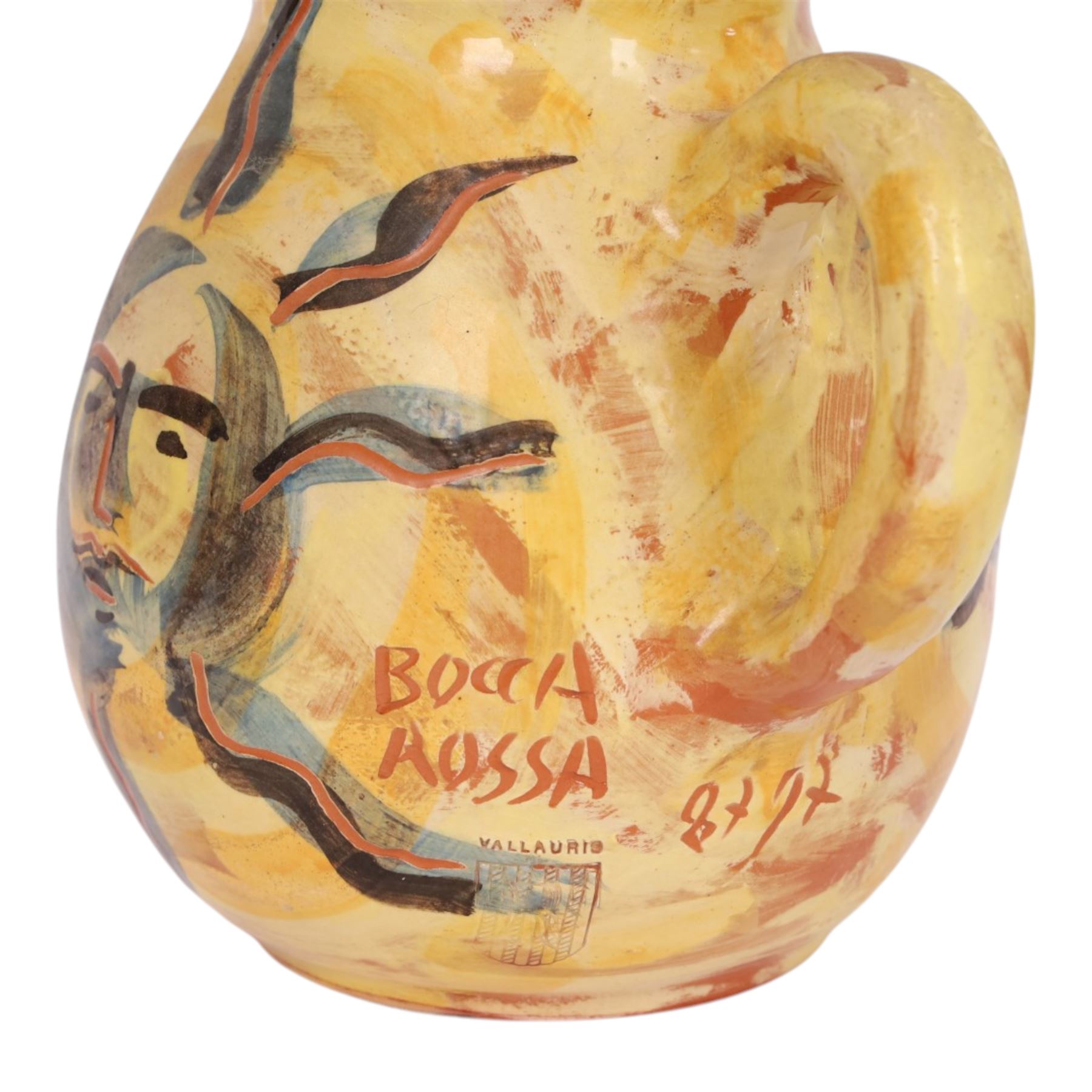 Vallauris French pottery by Patrick Bocca Rossa, jug painted with sun motifs upon a yellow ground, and an octagonal plate with a face to the center, both signed, jug H22cm 