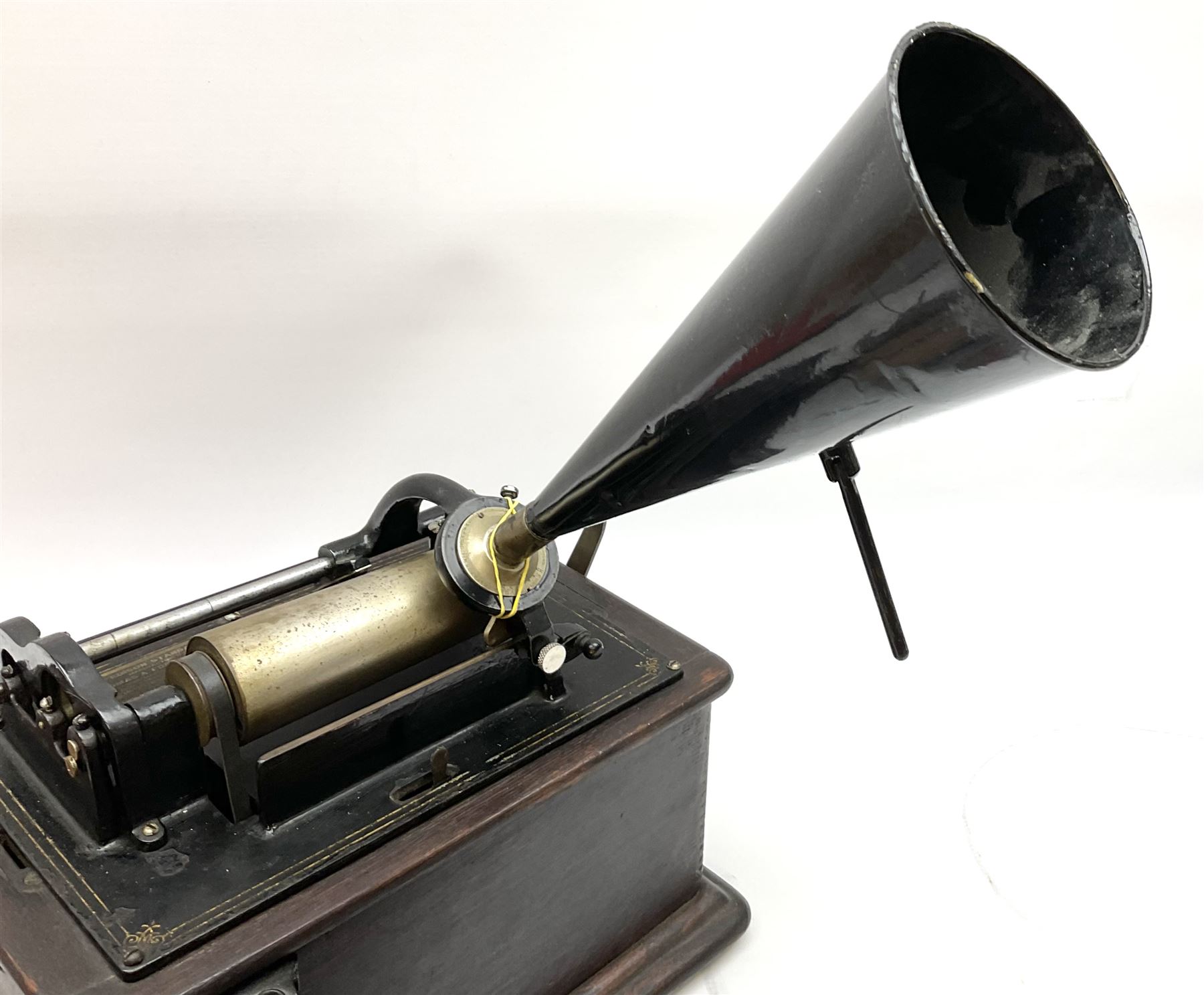 Edison Standard Phonograph with oak base (no cover), the reproducer marked 'Model C', serial no. 634857, last patent date Oct.1905, with black japanned conical horn L33cm; together with five cylinders