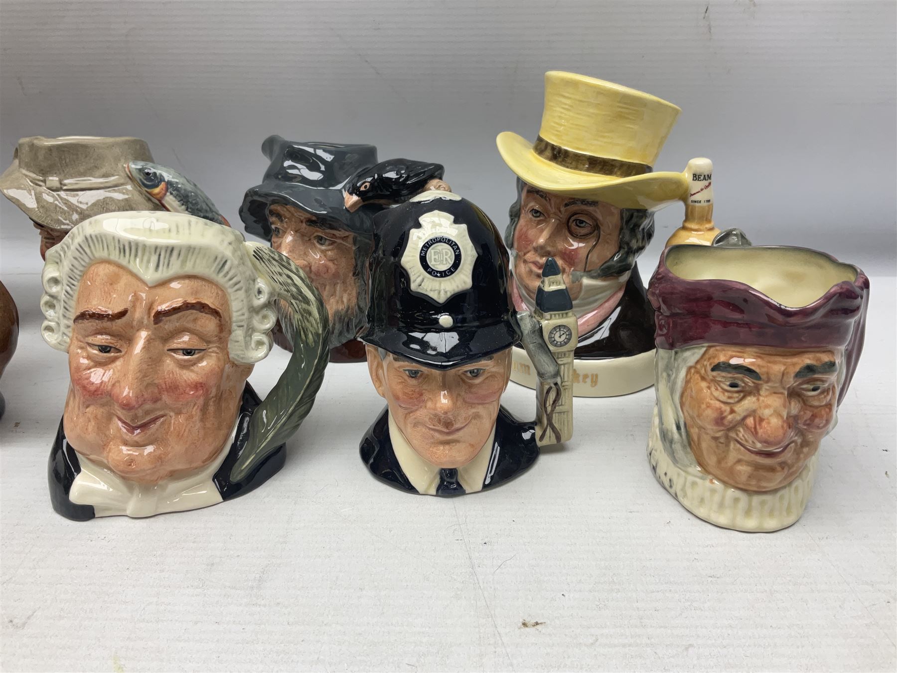 Large collection of Royal Doulton miniature character jugs, to include The Postman D6801, The London 'Bobby' D6762, Old Salt, D6554, Sir Henry Doulton D6703 etc  