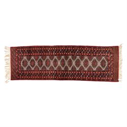 Tekke Bokhara hand knotted  runner, crimson field decorated with a series of repeating Tek...