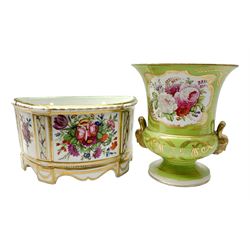 Continental campagna vase, circa 1900, with twin mask handles, the body decorated with panels of floral sprays and heightened with gilt upon a lime green ground, with spurious Derby type mark beneath, H20cm, together with a Continental bough pot decorated with floral sprays, L24cm