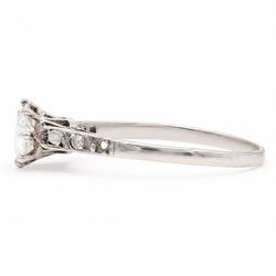 Early 20th century white gold and platinum diamond ring, eight claw set with a single old cut diamond of approx 0.70 carat and rose cut diamond shoulders, stamped PLAT 18ct