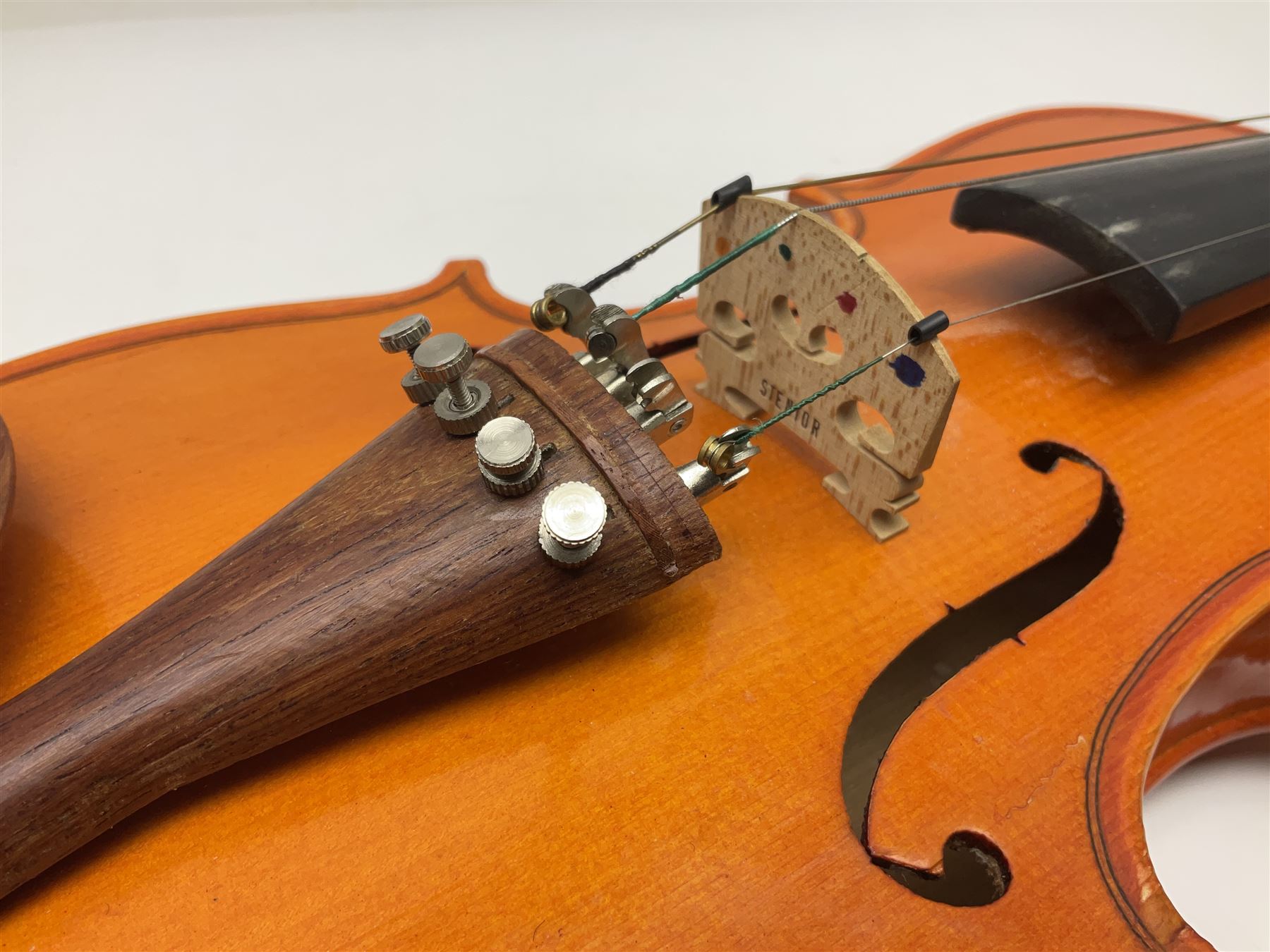 Three Stentor Student violins - three-quarter size with 33cm two-piece back; and two quarter size each with 28cm two-piece back; each in carrying case with bow (3)